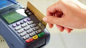 Card being inserted into a point-of-sale terminal